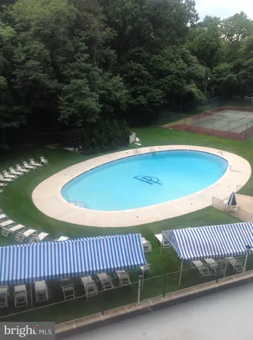 a view of a swimming pool with a patio