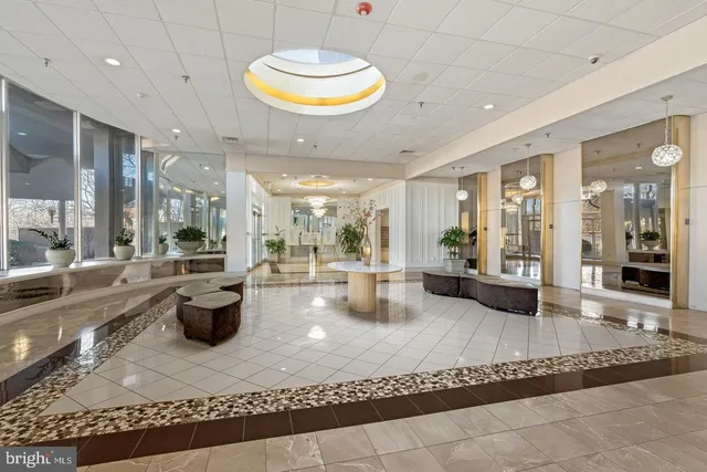 a view of a lobby with black carpet
