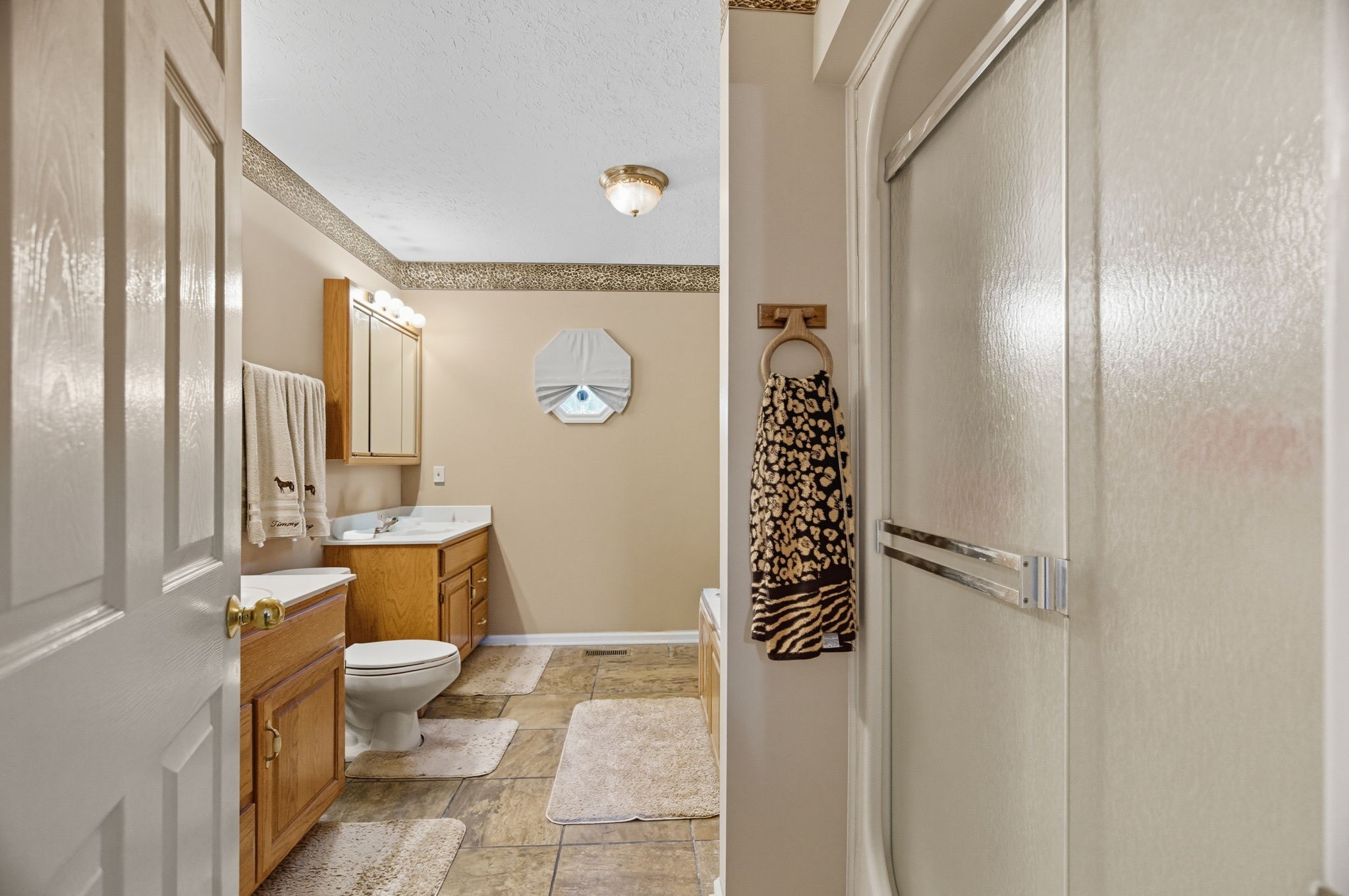 1021 Maple Grove Road Lafayette, TN 37083 - Photo 11 of 49 a bathroom with a granite countertop sink mirror vanity and toilet