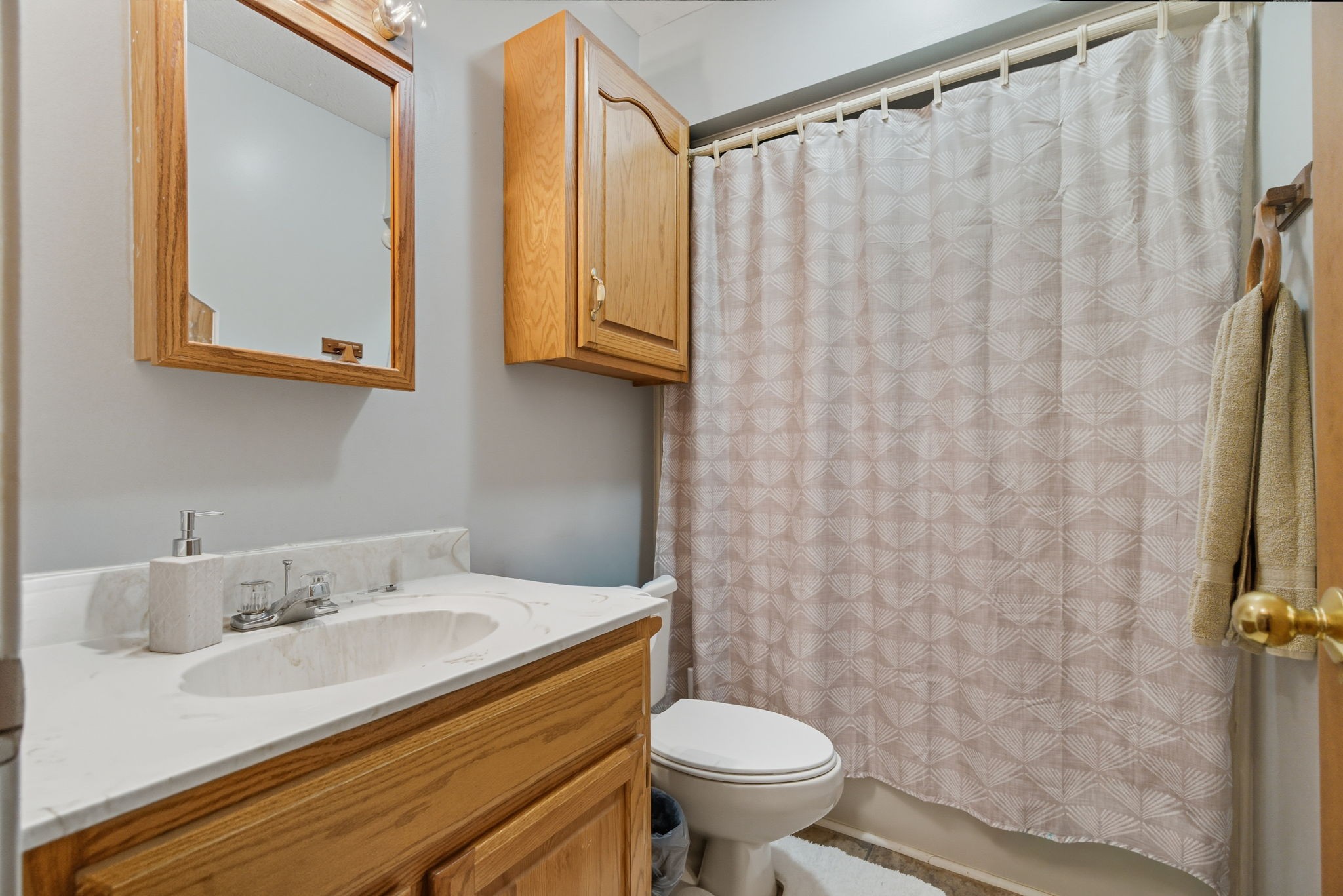 1021 Maple Grove Road Lafayette, TN 37083 - Photo 16 of 49 a bathroom with a sink toilet and shower