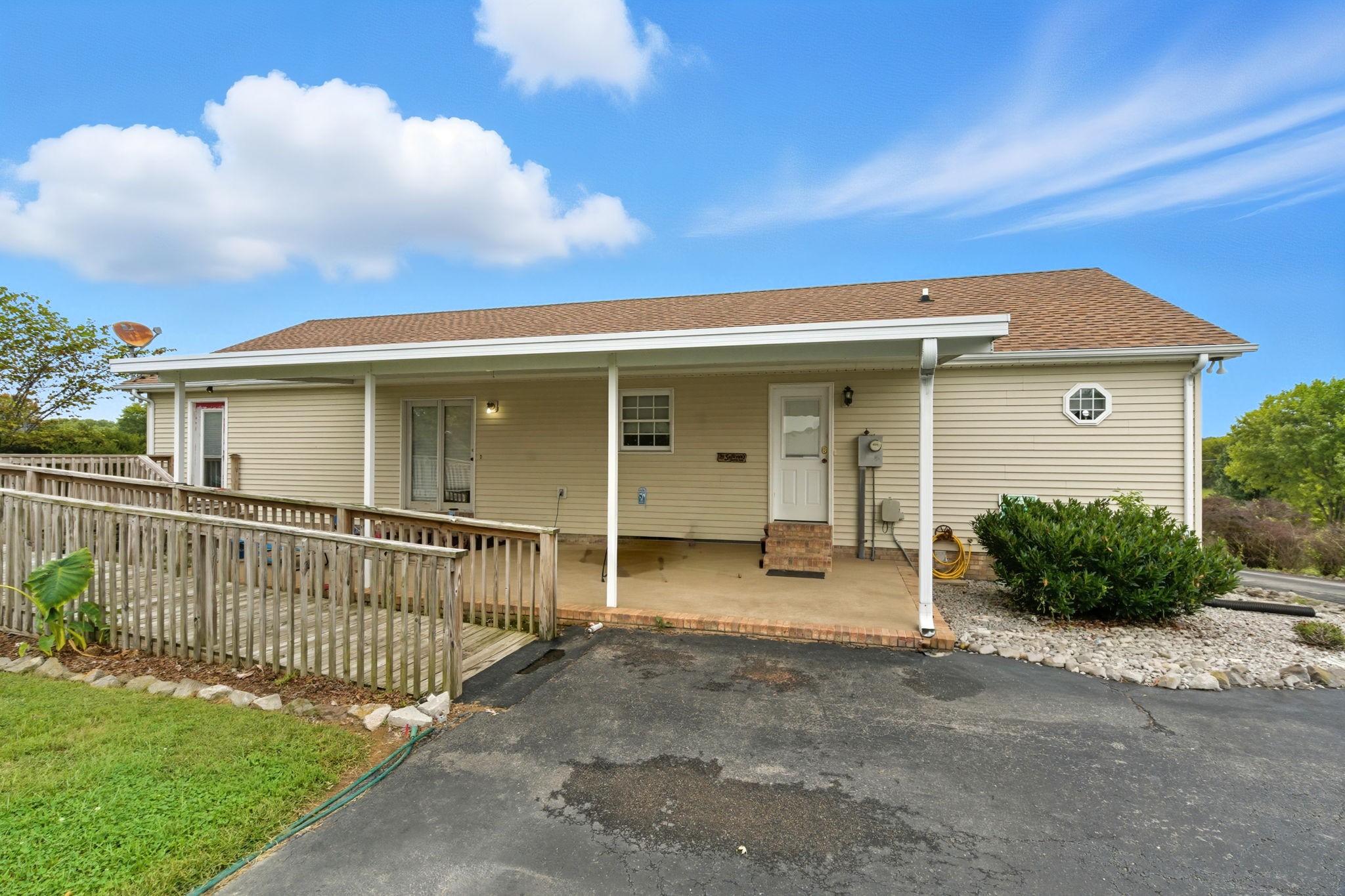 1021 Maple Grove Road Lafayette, TN 37083 - Photo 18 of 49 a front view of a house with a porch
