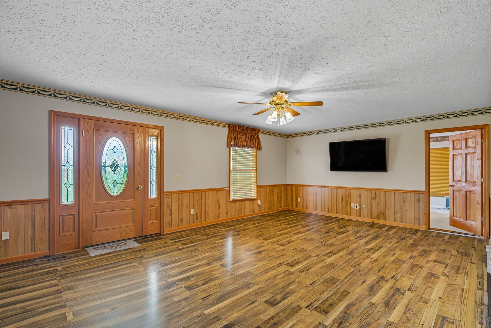 1021 Maple Grove Road Lafayette, TN 37083 - Photo 3 of 49 a view of a livingroom with a flat screen tv
