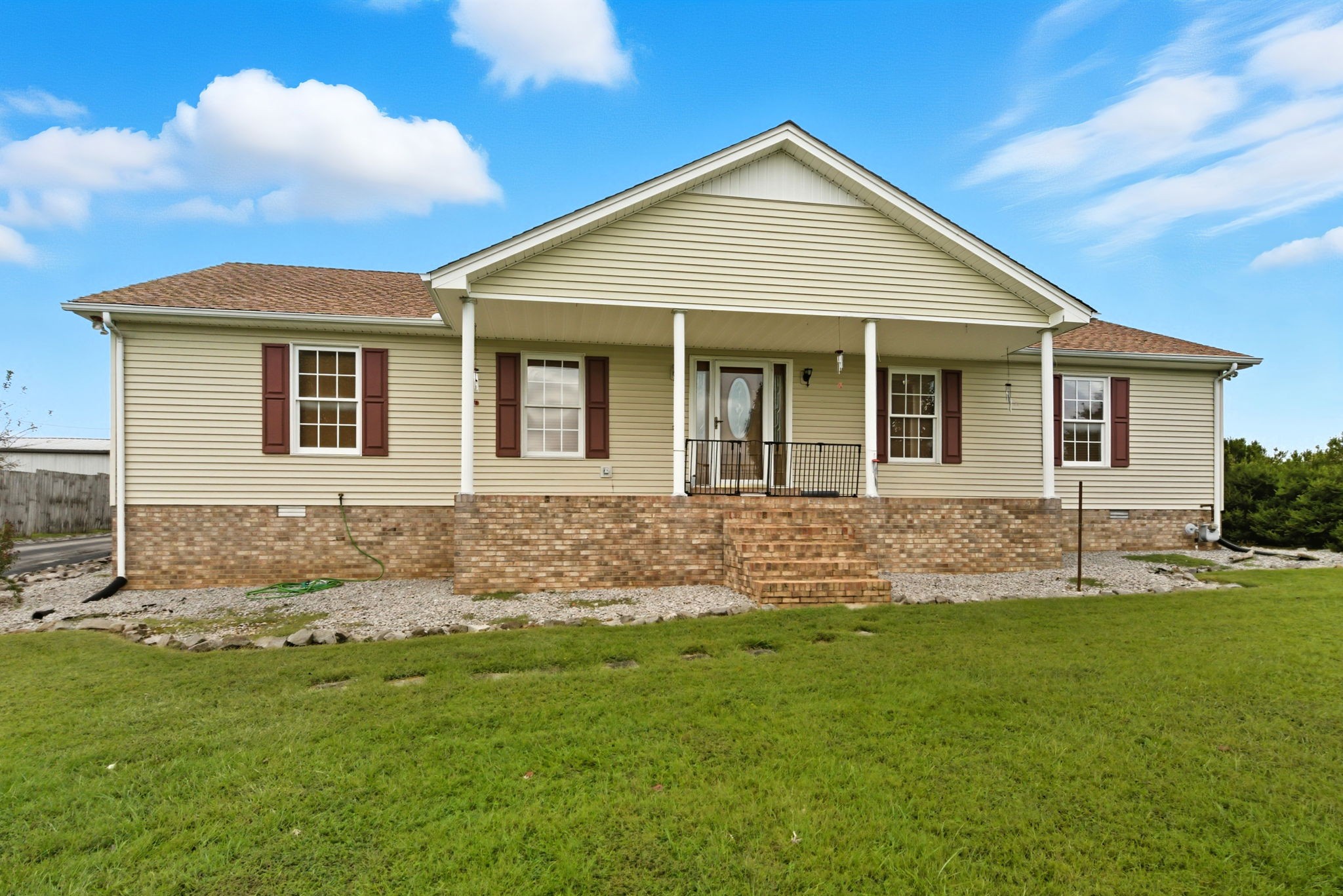 1021 Maple Grove Road Lafayette, TN 37083 - Photo 36 of 49 a front view of a house with a yard