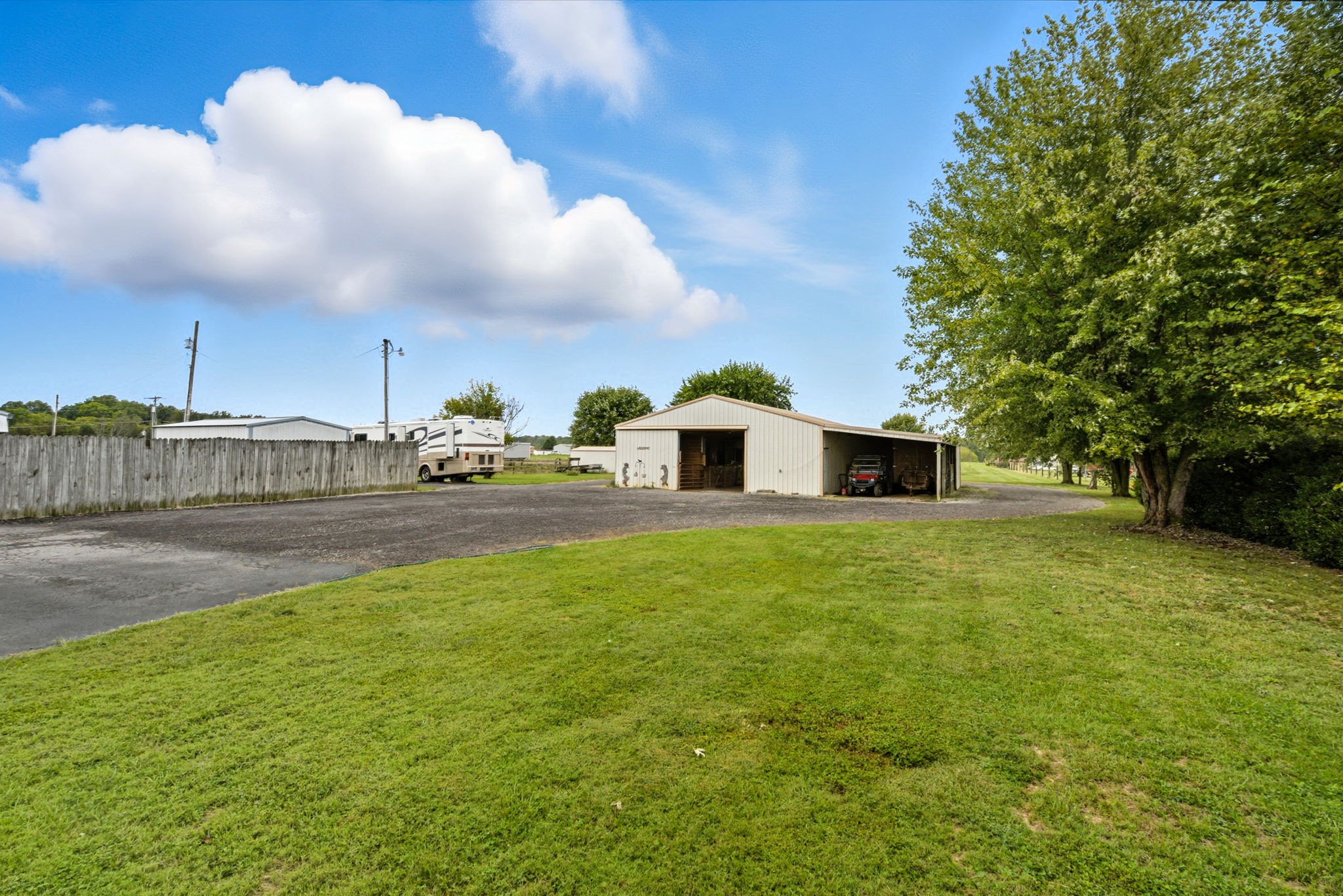1021 Maple Grove Road Lafayette, TN 37083 - Photo 37 of 49 a house view with swimming pool and trees in the background