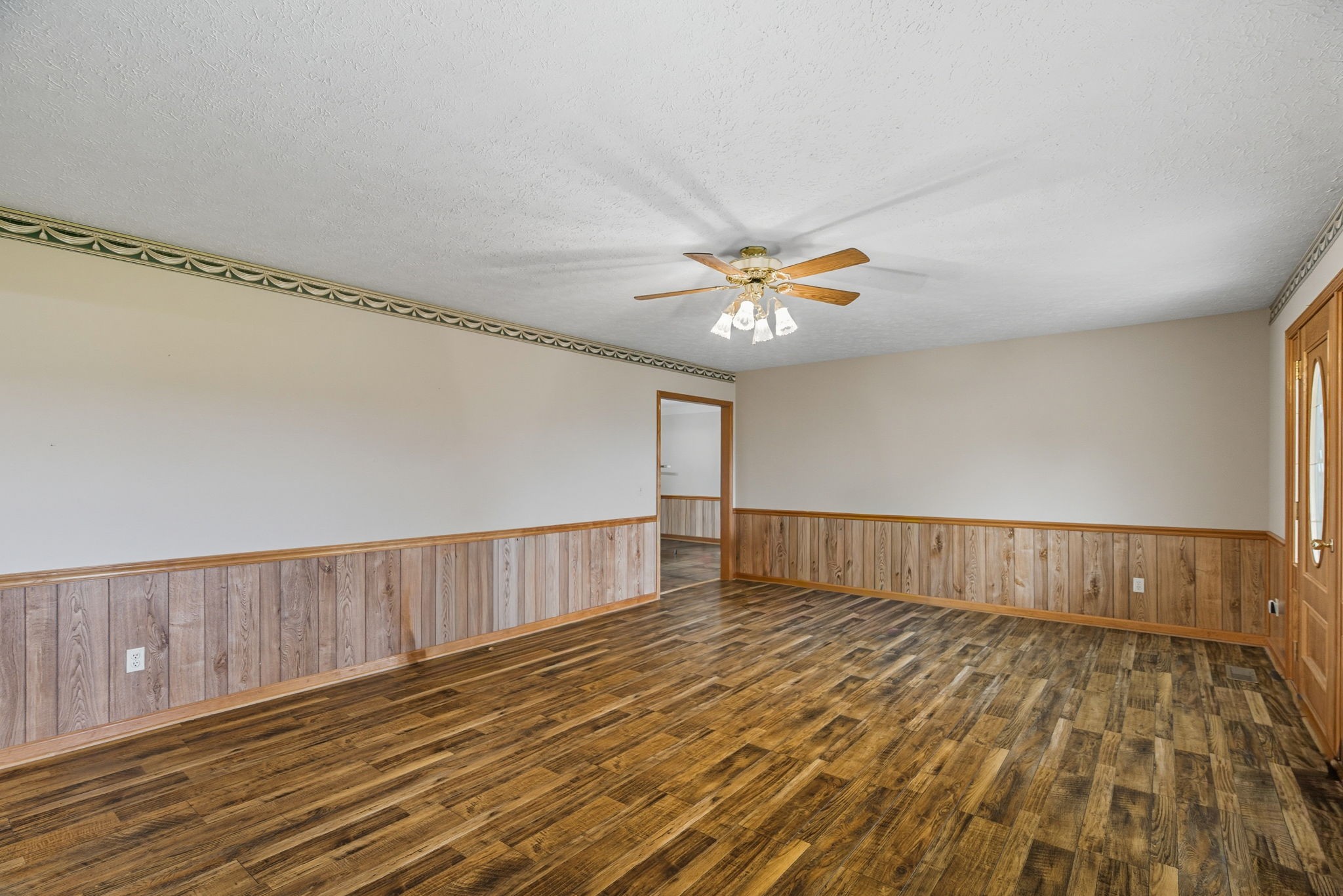 1021 Maple Grove Road Lafayette, TN 37083 - Photo 4 of 49 a view of an empty room with wooden floor
