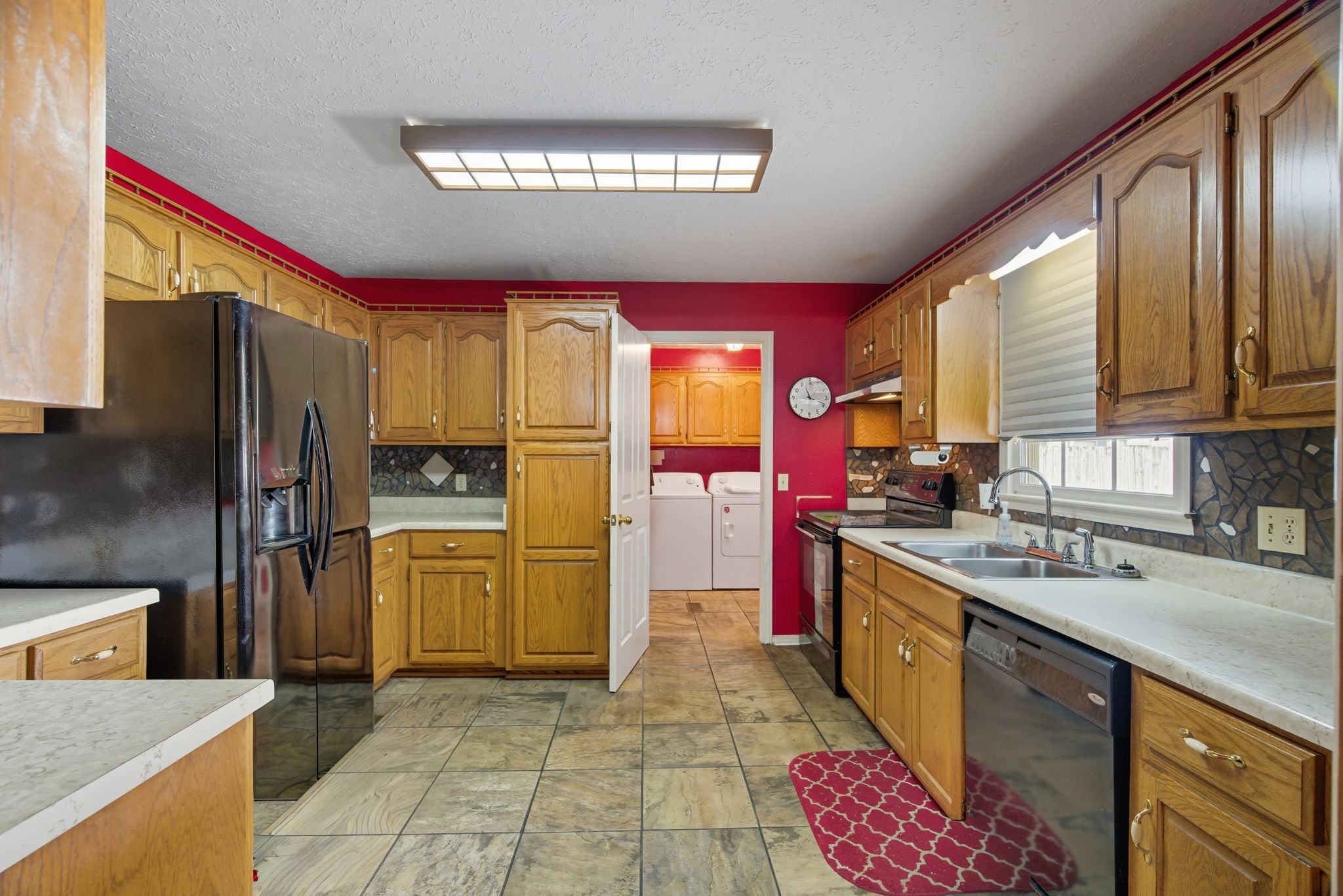1021 Maple Grove Road Lafayette, TN 37083 - Photo 5 of 49 a kitchen with a refrigerator sink and stove