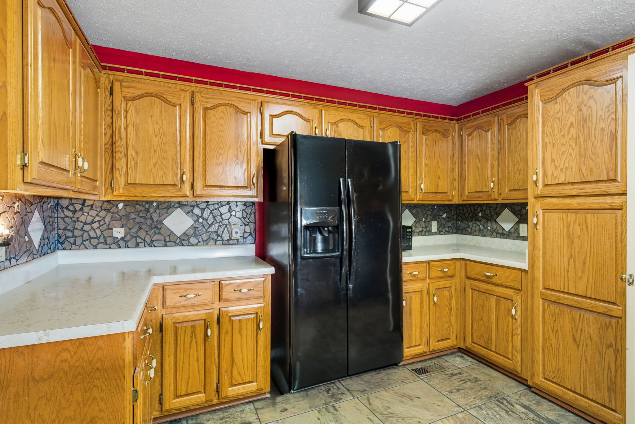 1021 Maple Grove Road Lafayette, TN 37083 - Photo 6 of 49 a kitchen with stainless steel appliances granite countertop a refrigerator and a stove