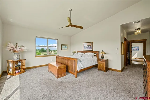 a bed room with a bed and a chandelier