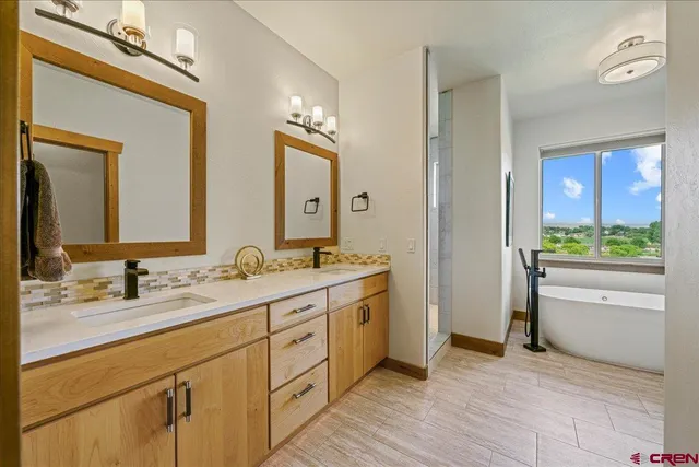 a bathroom with a granite countertop sink mirror and vanity