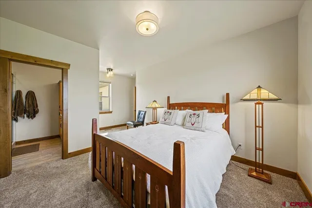 a bedroom with a bed and a table