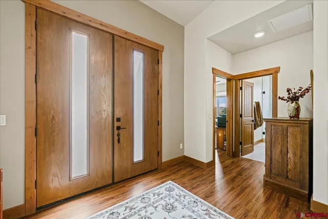 a view of entryway with wooden floor