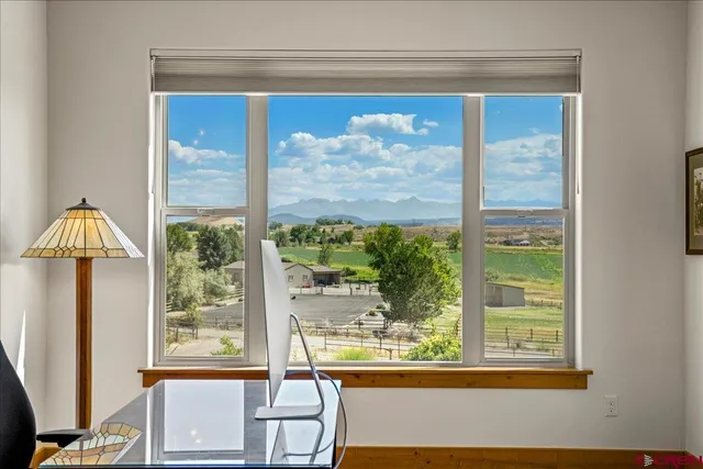 a view of a room that has a bed and a window