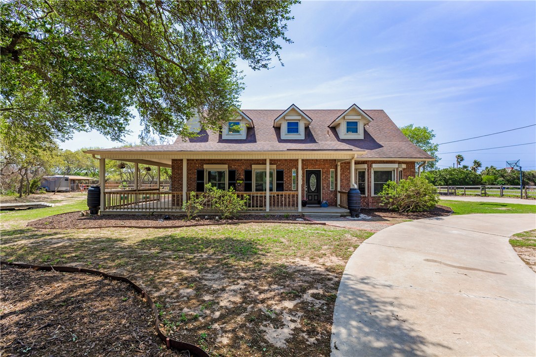 Brick, wood and vinal siding farmhouse style home