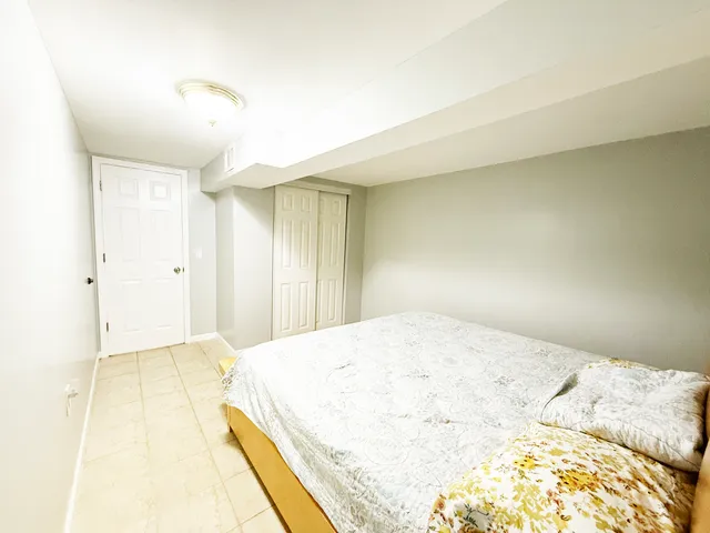 a spacious bedroom with a bed