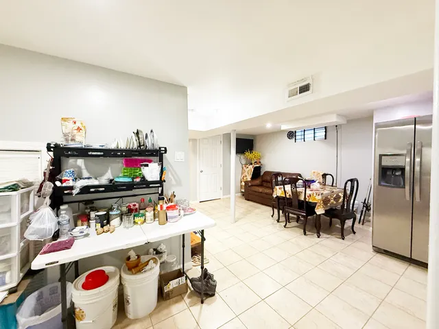 a bedroom with a bed and gym equipment
