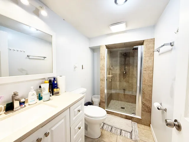 a living room with furniture and view of dining room