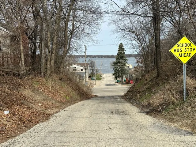 a view of a street with trees on the side of the road