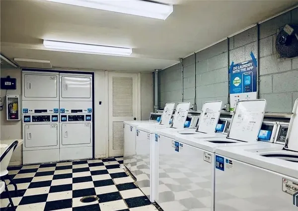 a kitchen with a sink and a refrigerator