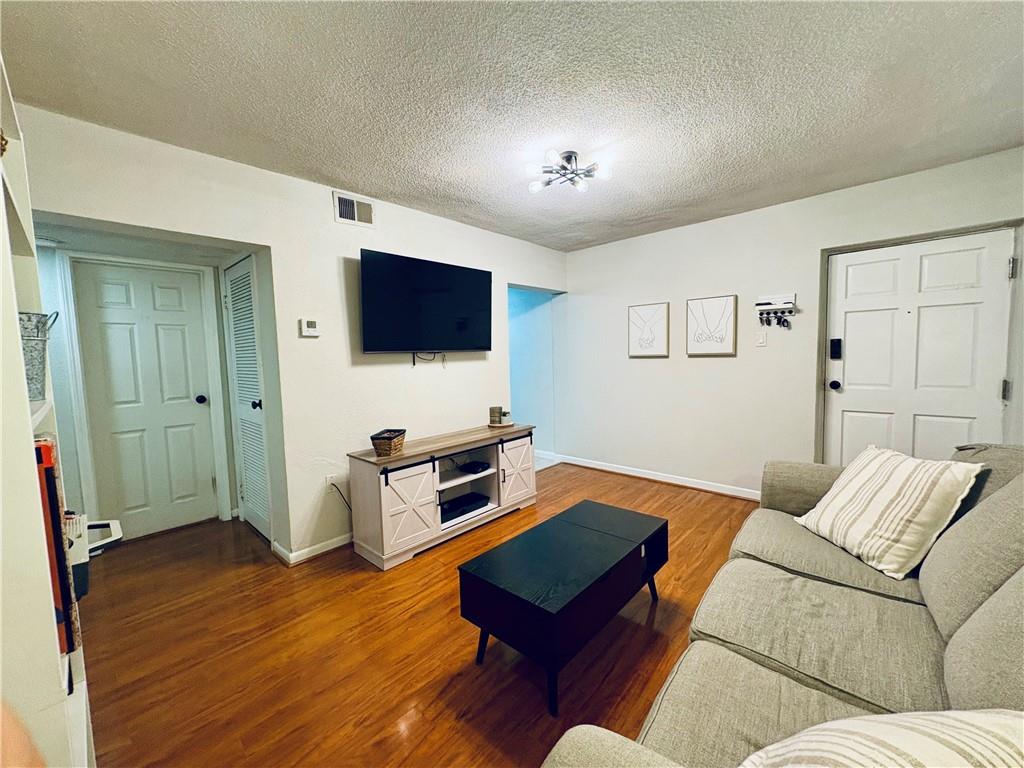 250 Little Street, Unit C101 Athens, GA 30605 - Photo 3 of 16 a living room with furniture and a flat screen tv