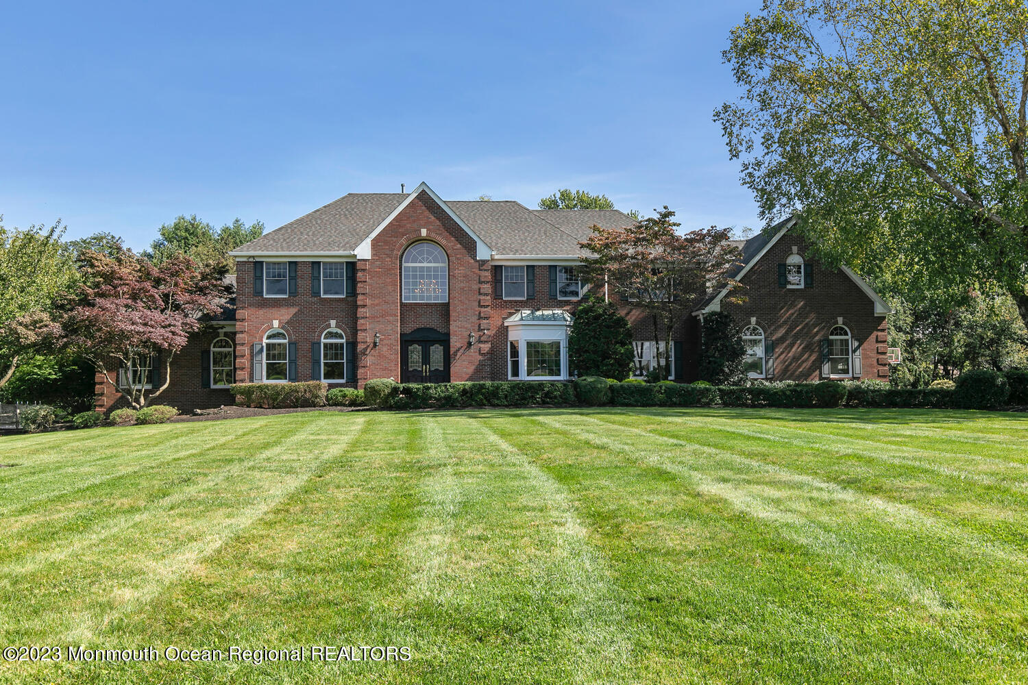 a front view of a house with a yard