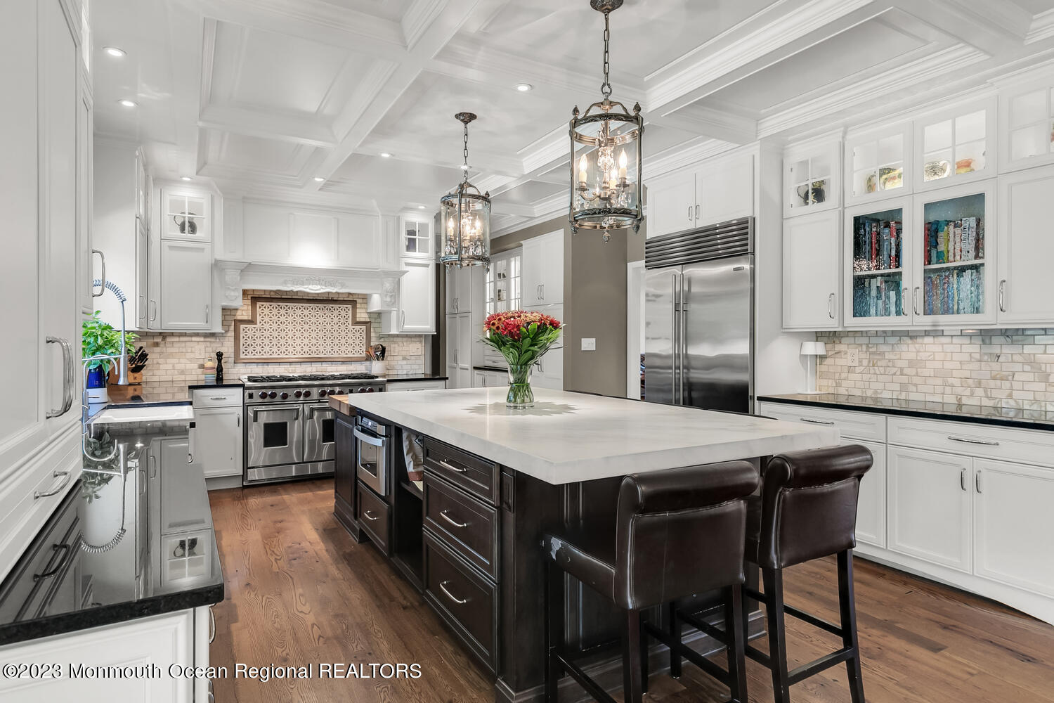 3 Goose Point Drive Colts Neck, NJ 07722 - Photo 16 of 66 a kitchen with stainless steel appliances granite countertop a kitchen island a stove a table and chairs in it