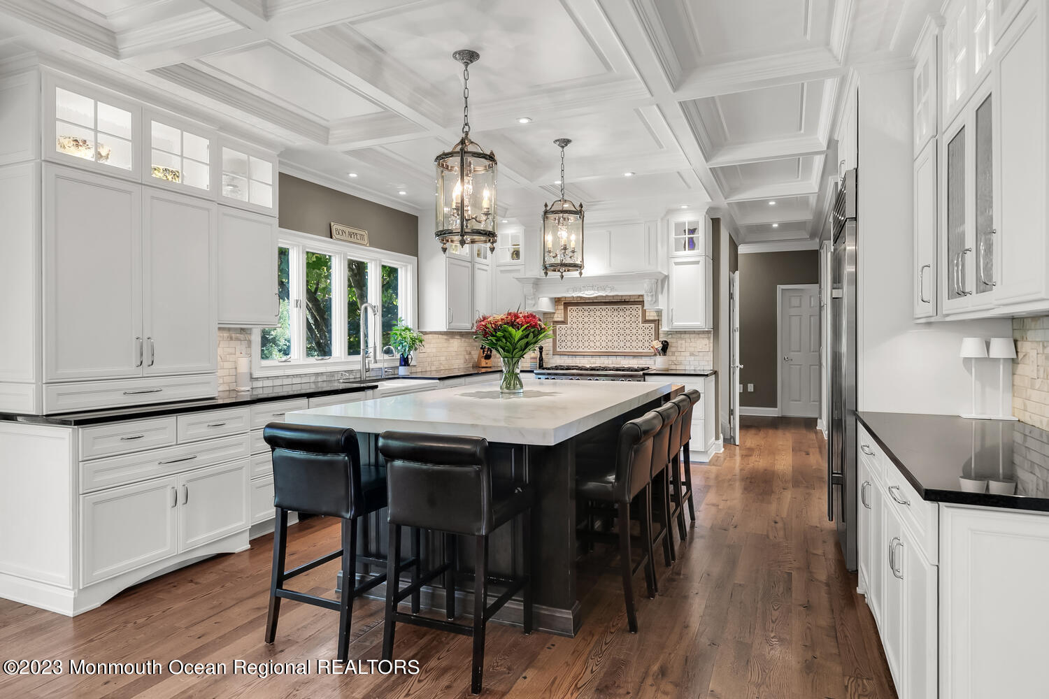 3 Goose Point Drive Colts Neck, NJ 07722 - Photo 17 of 66 a kitchen with stainless steel appliances granite countertop a kitchen island a stove a refrigerator a sink a dining table and chairs with wooden floor