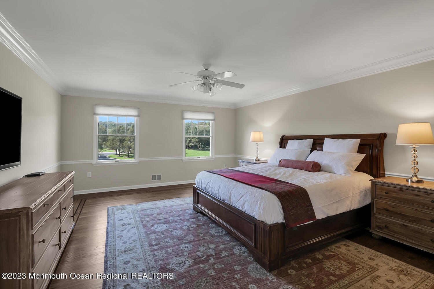 3 Goose Point Drive Colts Neck, NJ 07722 - Photo 27 of 66 a bedroom with a large bed and a tv on dresser