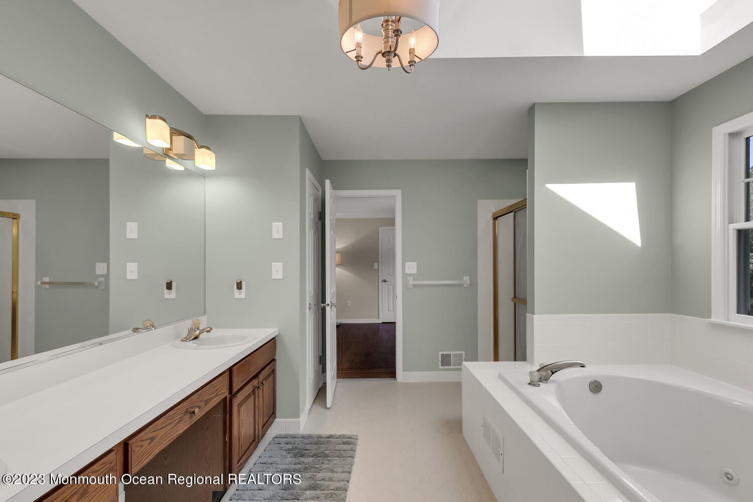 3 Goose Point Drive Colts Neck, NJ 07722 - Photo 30 of 66 a spacious bathroom with a tub a double vanity sink and a mirror