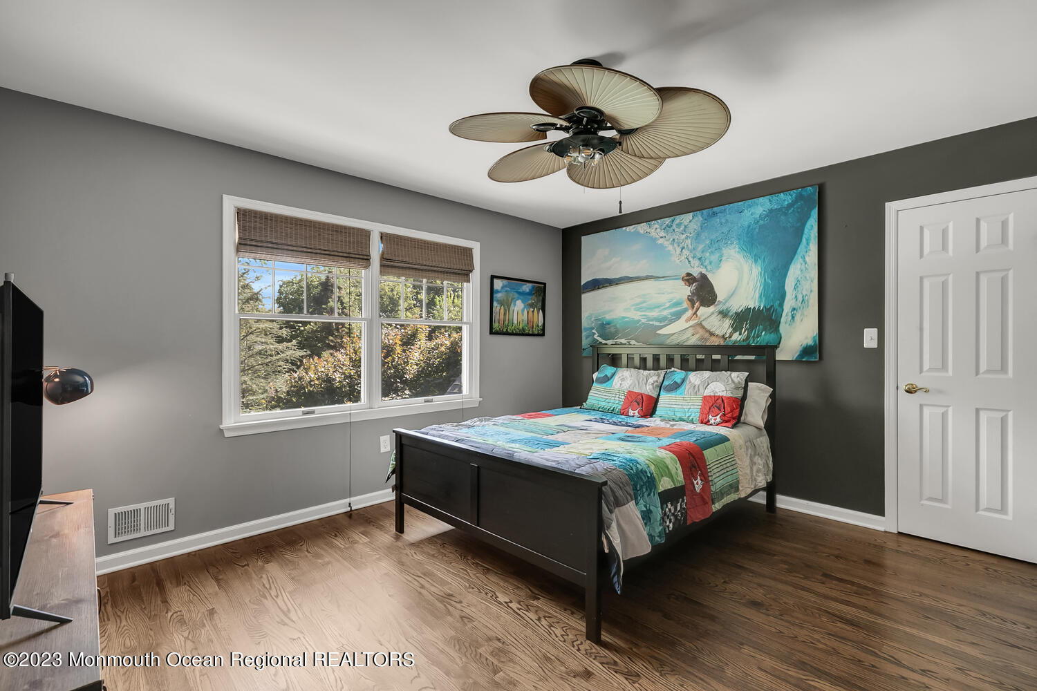 3 Goose Point Drive Colts Neck, NJ 07722 - Photo 36 of 66 a bedroom with a bed chandelier and a window