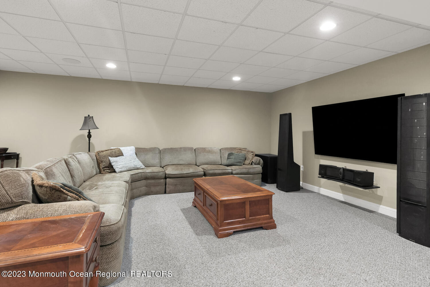 3 Goose Point Drive Colts Neck, NJ 07722 - Photo 38 of 66 a living room with furniture and a flat screen tv