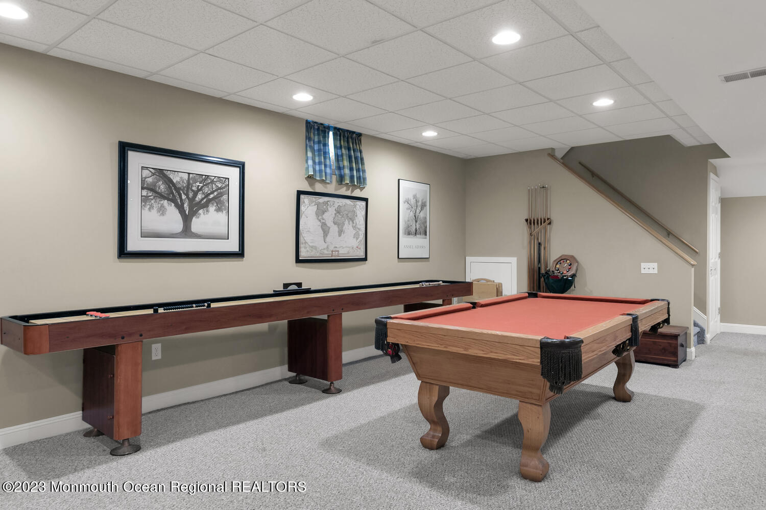 3 Goose Point Drive Colts Neck, NJ 07722 - Photo 39 of 66 a bedroom with a bed and paintings on the wall