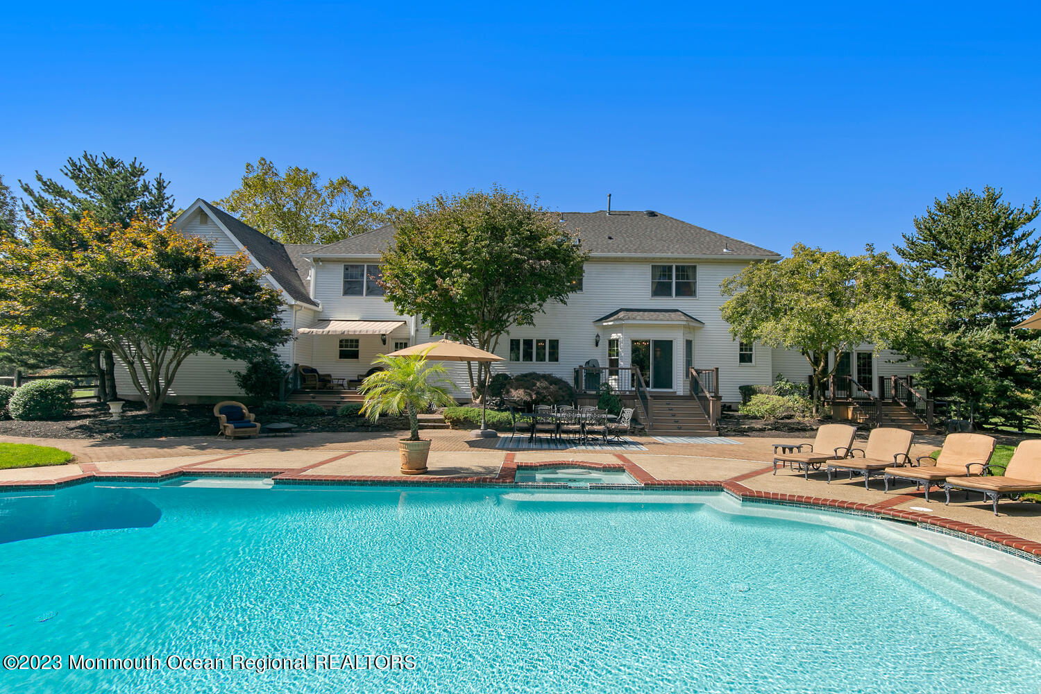 3 Goose Point Drive Colts Neck, NJ 07722 - Photo 4 of 66 a front view of a house with sitting area