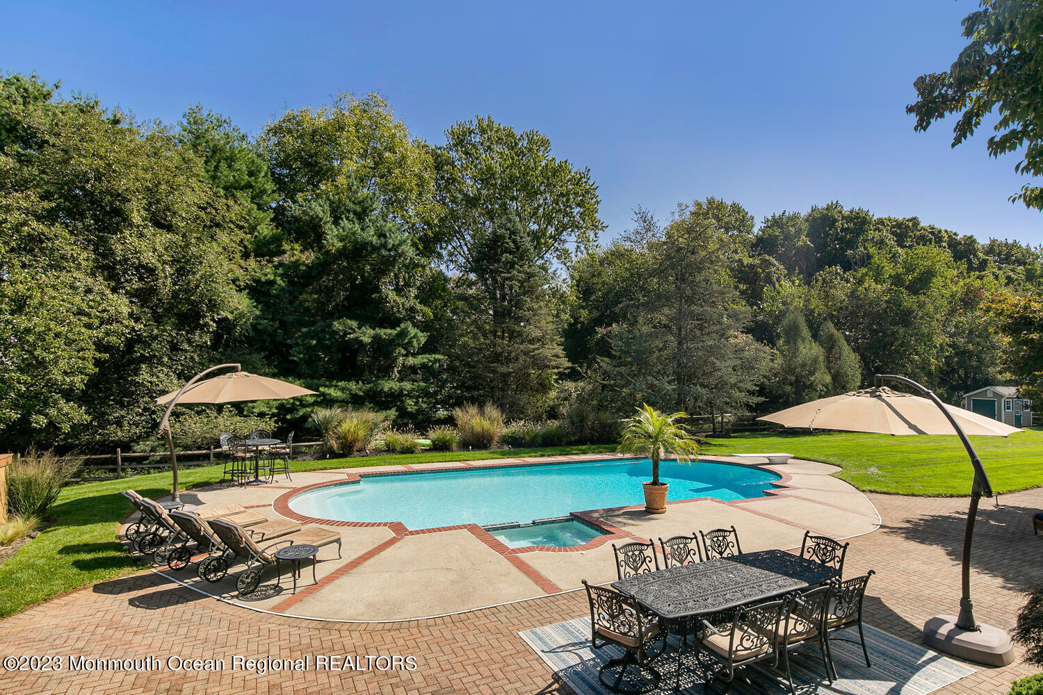 3 Goose Point Drive Colts Neck, NJ 07722 - Photo 45 of 66 an outdoor space with furniture and umbrella