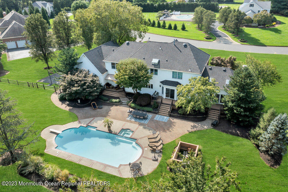 3 Goose Point Drive Colts Neck, NJ 07722 - Photo 47 of 66 an aerial view of a house with a garden and lake view