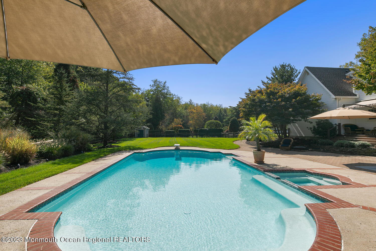 3 Goose Point Drive Colts Neck, NJ 07722 - Photo 59 of 66 a view of a swimming pool with a yard