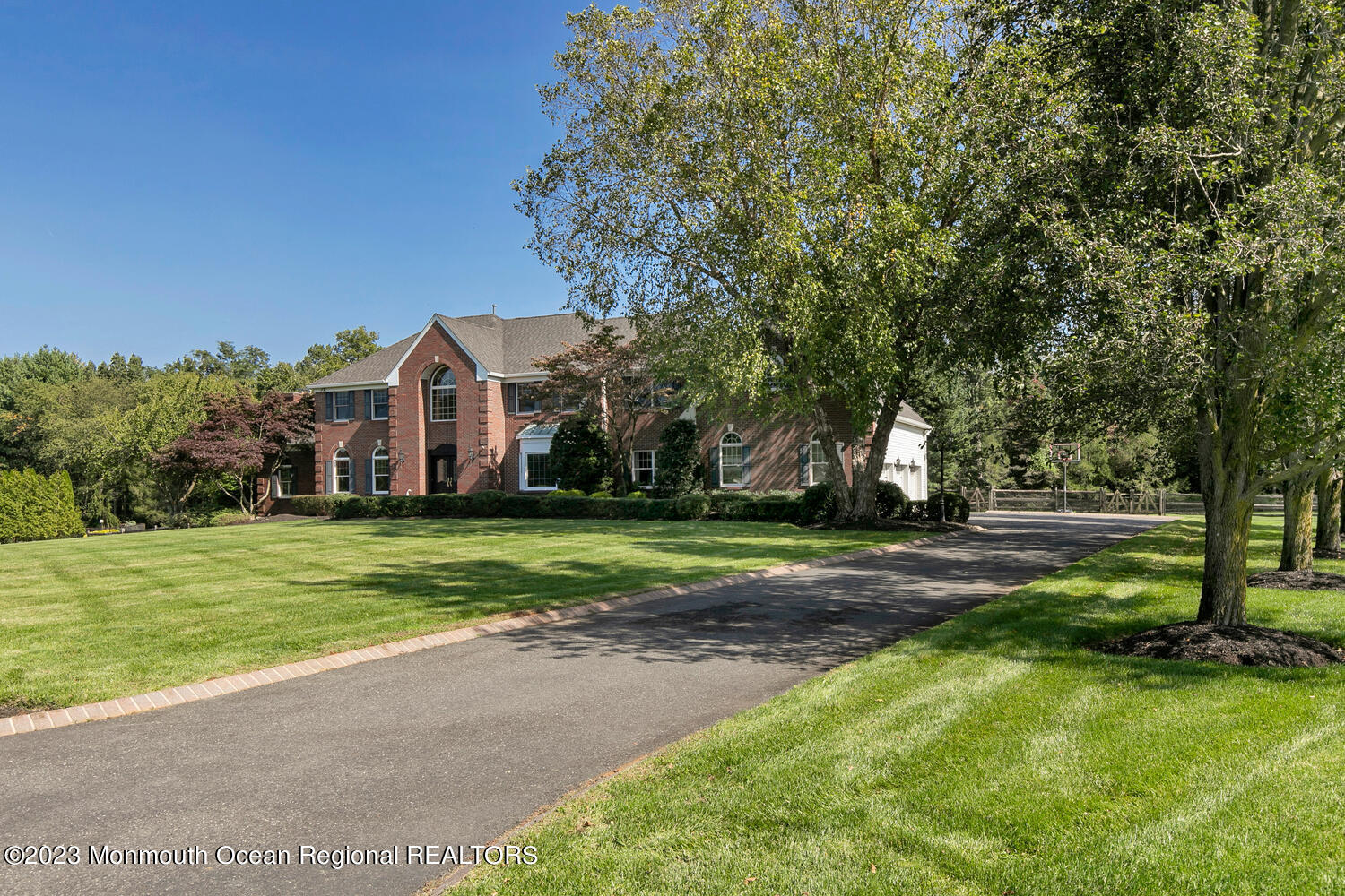 3 Goose Point Drive Colts Neck, NJ 07722 - Photo 62 of 66 a front view of a house with a yard