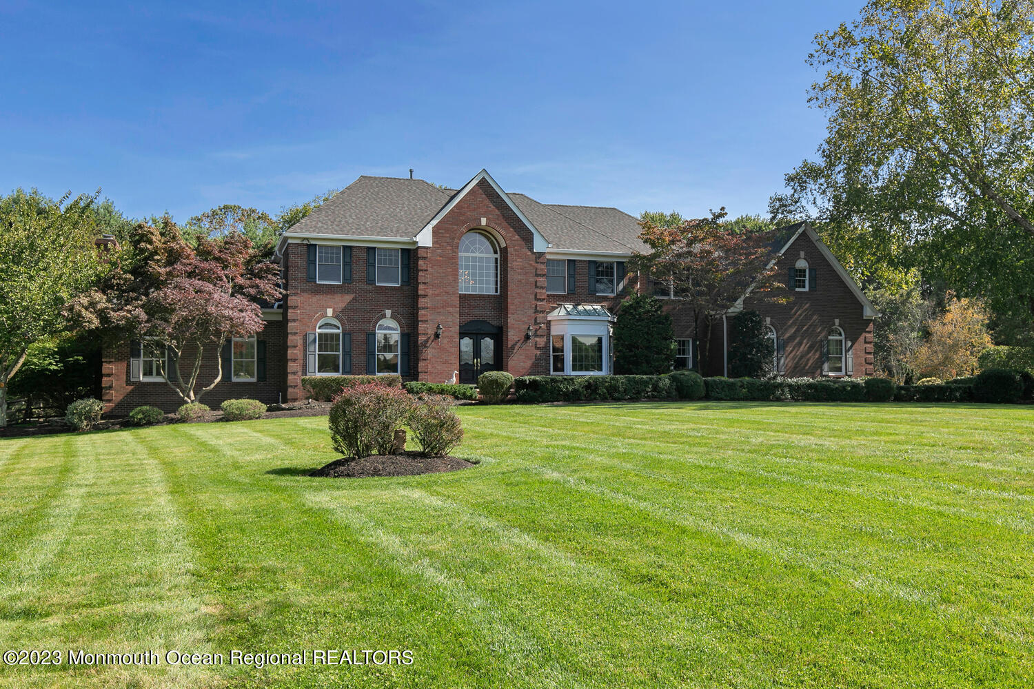 3 Goose Point Drive Colts Neck, NJ 07722 - Photo 64 of 66 a front view of a house with a yard