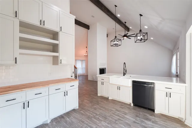 a view of a kitchen with electric appliances
