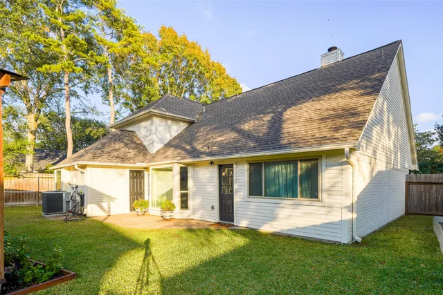 a view of backyard with a garden and deck