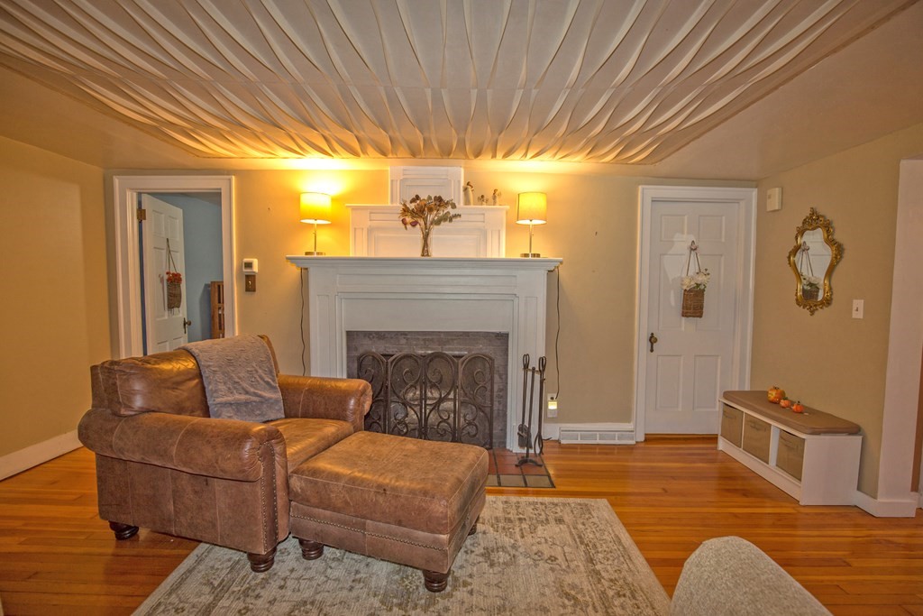 173 Cottage Road Enfield, CT 06082 - Photo 20 of 41 a living room with furniture and a fireplace