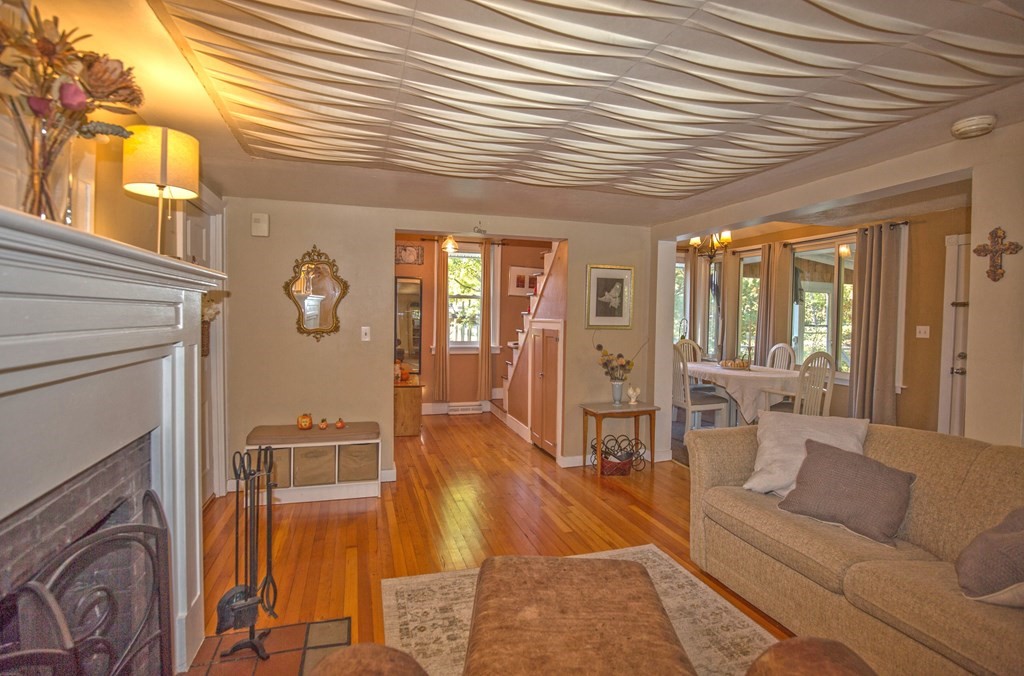 173 Cottage Road Enfield, CT 06082 - Photo 22 of 41 a living room with furniture and a fireplace