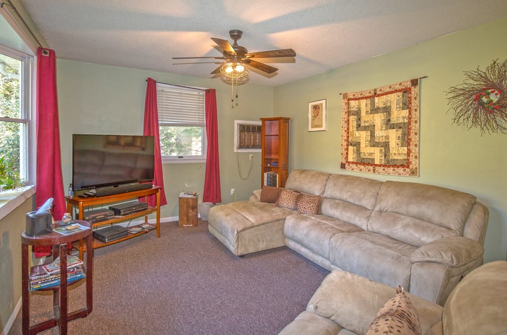173 Cottage Road Enfield, CT 06082 - Photo 24 of 41 a living room with furniture and a flat screen tv