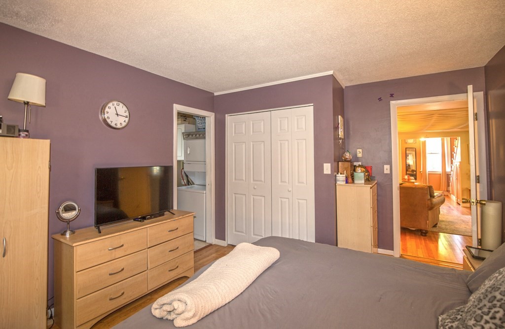 173 Cottage Road Enfield, CT 06082 - Photo 32 of 41 a bedroom with a bed and a flat screen tv
