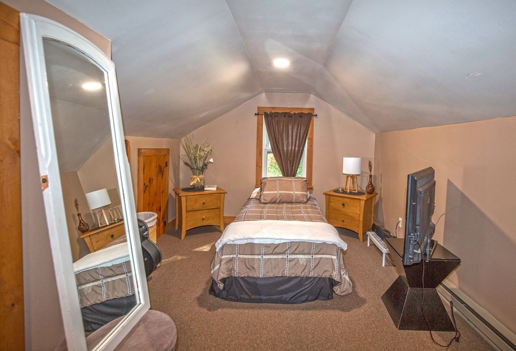 173 Cottage Road Enfield, CT 06082 - Photo 37 of 41 a bedroom with bed and a mirror