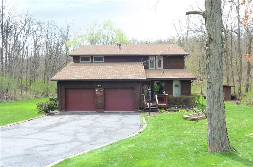 Welcome home to this lovely home located on a private wooded lot. 