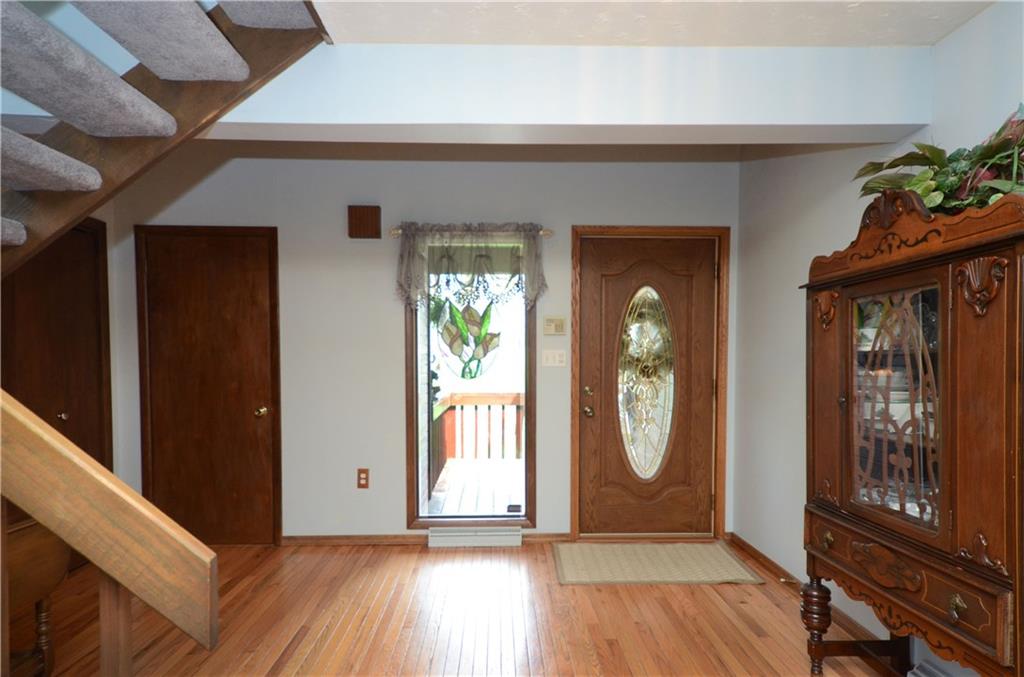 5639 Aiken Road McKees Rocks, PA 15136 - Photo 3 of 23 The entry includes hardwood floors and a half bath.