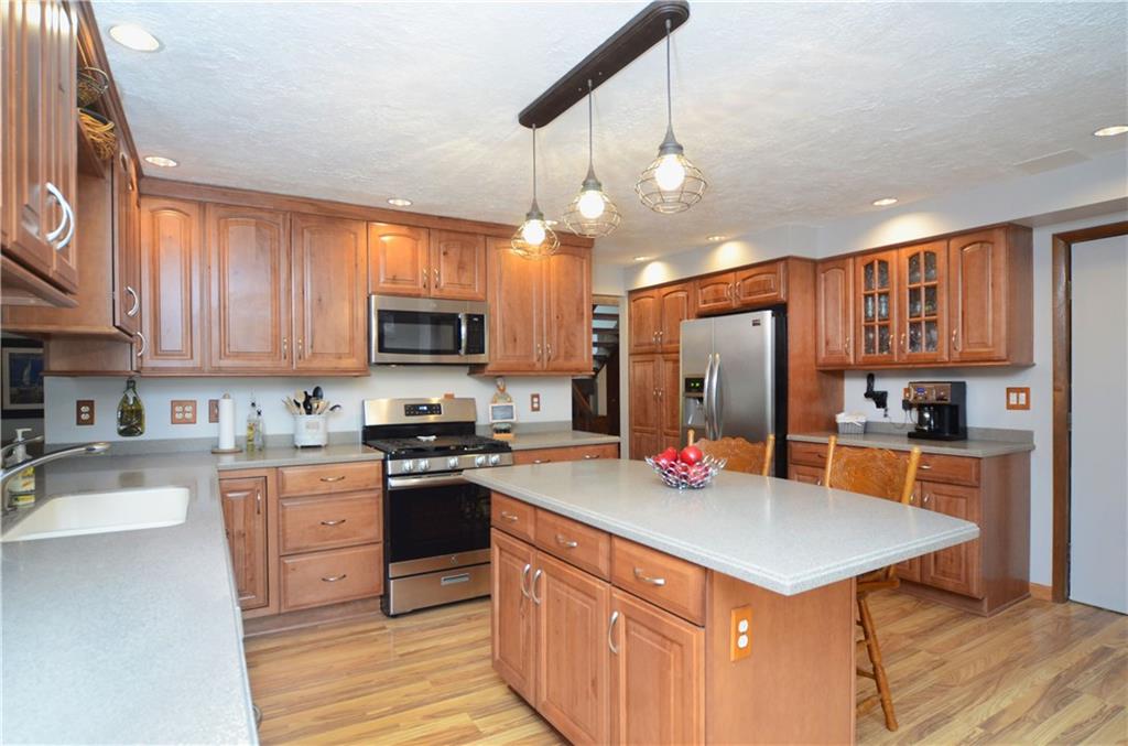 5639 Aiken Road McKees Rocks, PA 15136 - Photo 9 of 23 The kitchen offers laminate flooring and custom cabinetry.