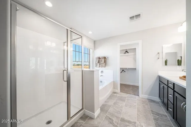 a kitchen with stainless steel appliances a refrigerator and cabinets
