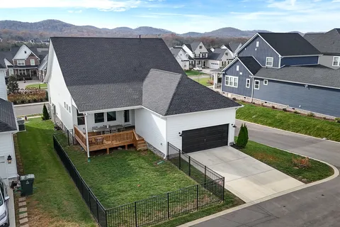 an aerial view of a house with a garden