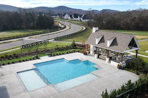 a view of a street with a yard